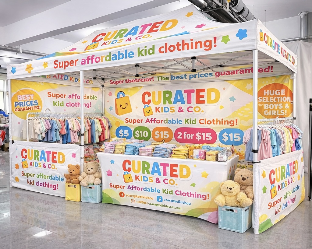 Curated Kids & Co. pop-up booth with colorful children's clothing